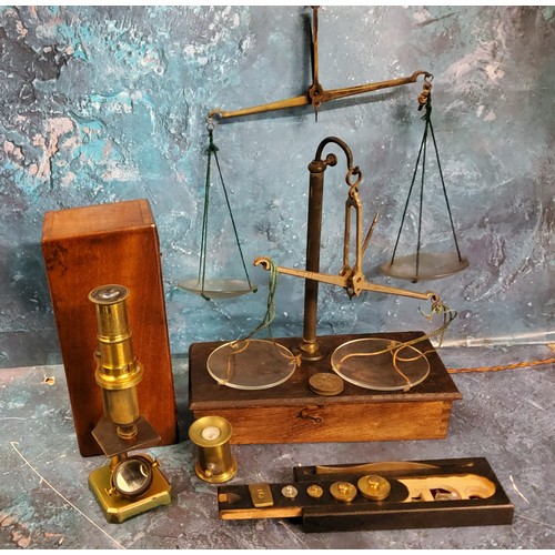 617 - A 19th century brass student microscope, 16cm high, fitted mahogany case; a 19th century set of bala... 