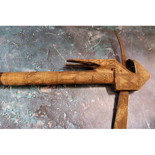 622 - Tribal Art - an Eritrean battle axe, geometrically carved, 58cm long