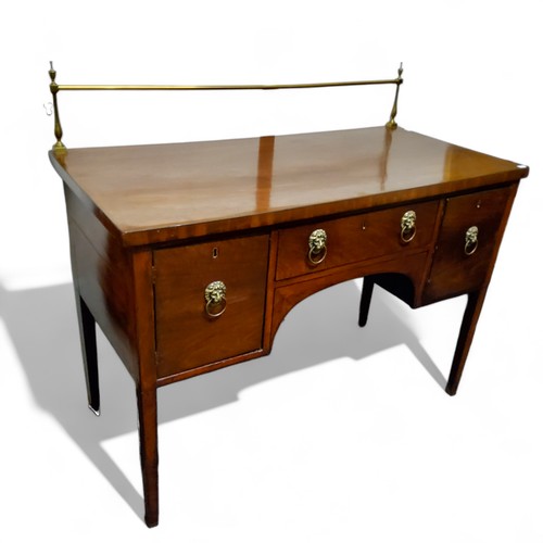 624 - A George III mahogany sideboard, brass gallery above  long drawer flanked by deep drawer and cupboar... 