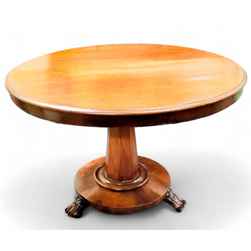 625 - A 19th century mahogany circular centre table, spreading octagonal column, dished base with   bold l... 