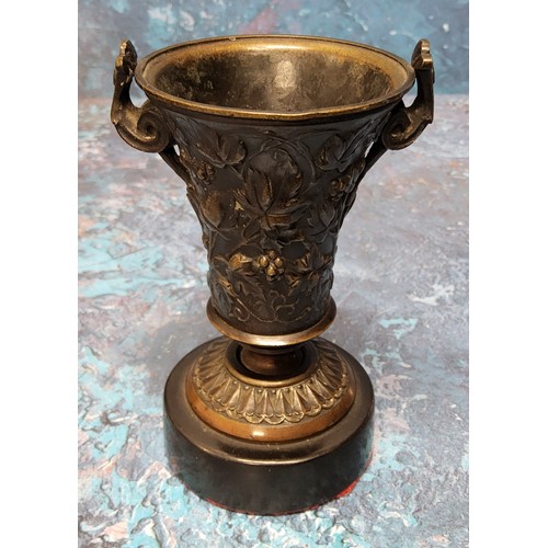 637 - A 19th century bronze urn, of waisted cylindrical form, cast with scrolling foliage, scroll handles,... 