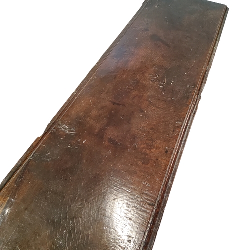 654 - An early 17th century English six plank elm sword box,  studded joints, ironwork hinges and lock pla... 