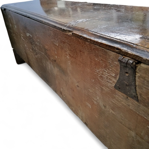 654 - An early 17th century English six plank elm sword box,  studded joints, ironwork hinges and lock pla... 