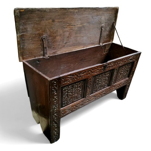 661 - A mid 17th century English oak and elm heavily carved coffer c.1650, 66cm high, 117cm wide, 41cm dep... 