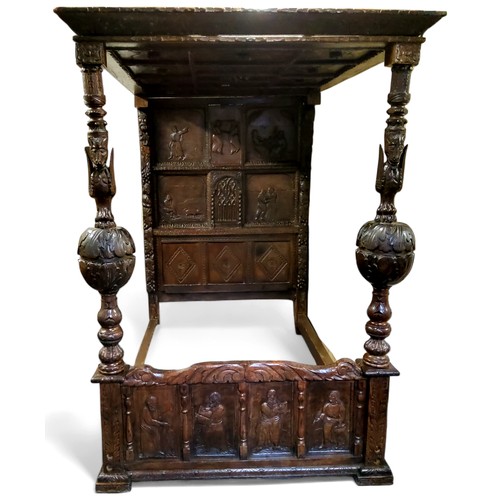 662 - An 'Elizabeth I' oak tester bed, the oversailing thirteen fielded panelled tester canopy in relief w... 