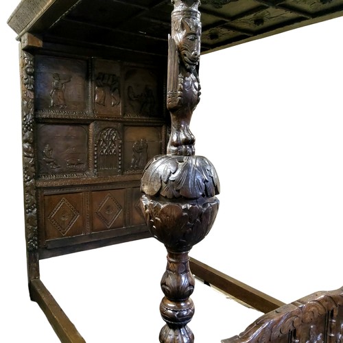 662 - An 'Elizabeth I' oak tester bed, the oversailing thirteen fielded panelled tester canopy in relief w... 