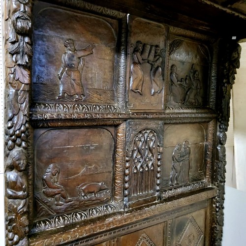 662 - An 'Elizabeth I' oak tester bed, the oversailing thirteen fielded panelled tester canopy in relief w... 