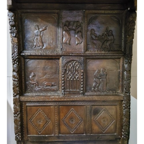 662 - An 'Elizabeth I' oak tester bed, the oversailing thirteen fielded panelled tester canopy in relief w... 