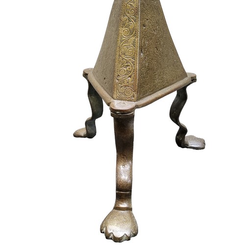 687 - A large 18th century Eastern bronze pricket stand, chased throughout with cows, exotic birds and fol... 