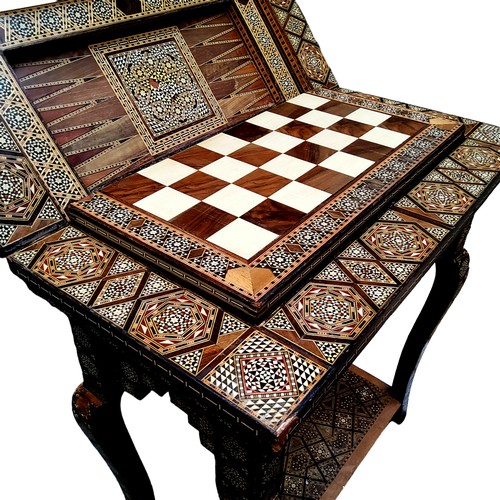 694 - A 19th century Anglo Indian games compendium, the folding vizagapatam/micromosaic inset table opens ... 