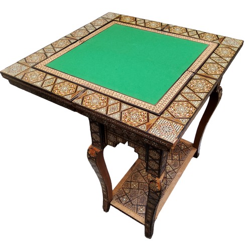 694 - A 19th century Anglo Indian games compendium, the folding vizagapatam/micromosaic inset table opens ... 