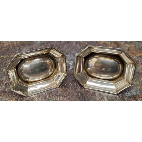 42 - A pair of George II silver canted rectangular trencher salts, each stipple engraved I  I.P  P.A  173... 