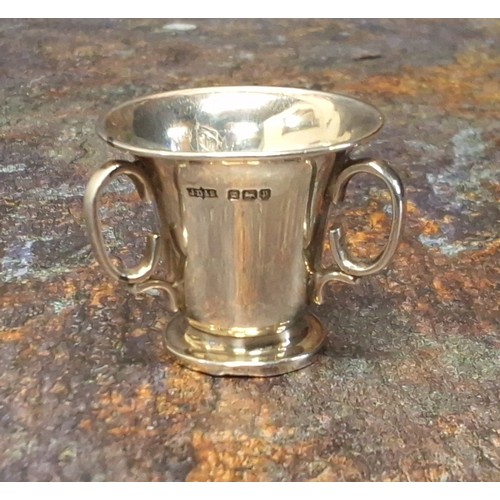 44 - Golfing interest - a silver miniature trophy in the form of a tyg, engraved Troon, Oct. 1949 Winner ... 