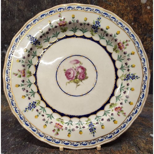 294 - A Derby shaped circular dessert plate, painted with floral sprays, the rim with interlaced turquoise... 