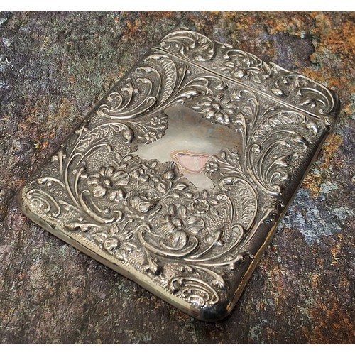 140 - An Edwardian silver rounded rectangular visiting card case, embossed with  leafy scrolls and flowers... 