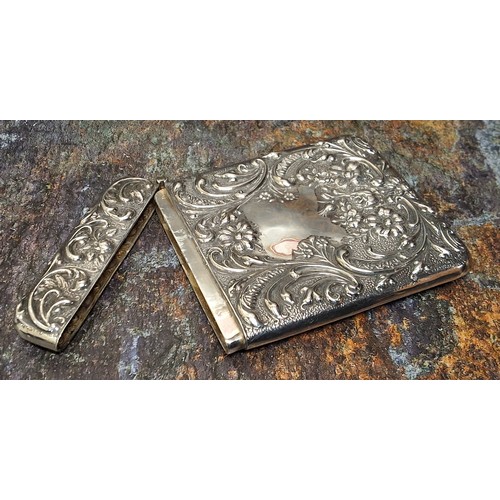 140 - An Edwardian silver rounded rectangular visiting card case, embossed with  leafy scrolls and flowers... 