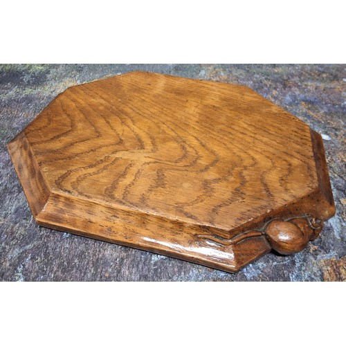 503 - Robert Thompson, Mouseman of Kilburn - an oak octagonal cheese board, 30.5cm long, carved mouse sign... 