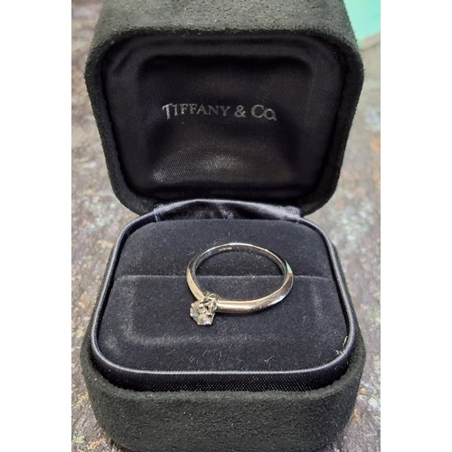 80 - A Tiffany & Co platinum and diamond solitaire, claw set brilliant cut round diamond, 0.25ct, 4.0... 