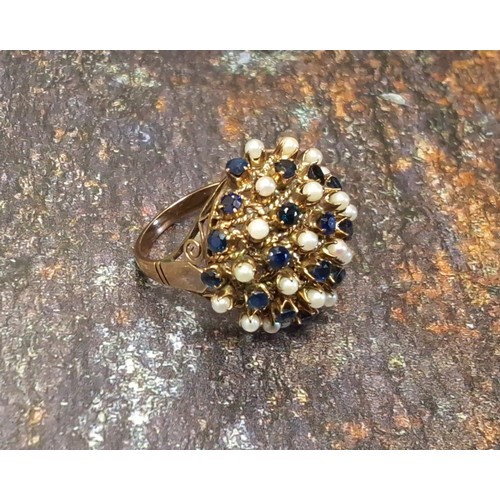 106 - An unusual 14k sapphire and seed pearl cluster ring in the form of a flower frog set with alternate ... 