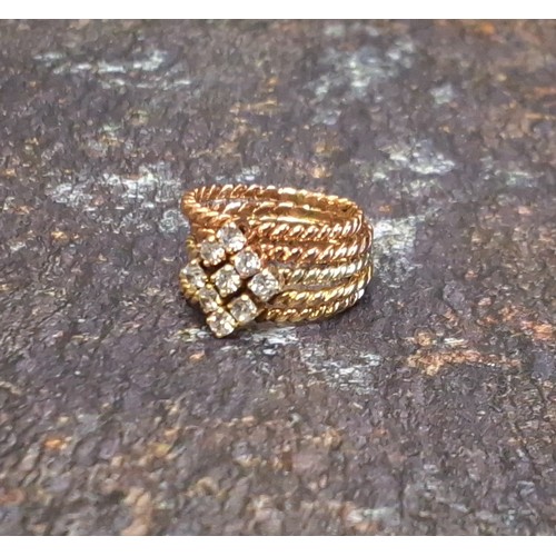 109 - A 9ct gold and rose gold and diamond stacking rings each claw set with either one, two or three diam... 