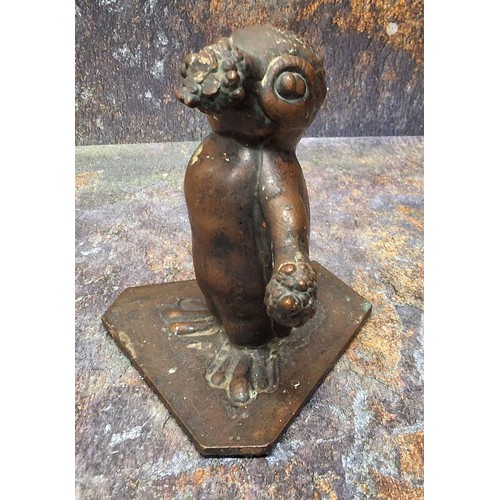 506 - A 20th century bronze, of a grotesque penguin, canted triform base, 16cm high