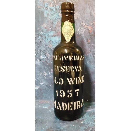 712 - A bottle of D'Oliveiras Reserva Old Wine Madeira, 1957, 70cl, Selo de Garantia Madeira No.637697, le... 