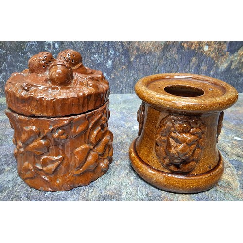 194 - A 19th century brown salt glazed stoneware tobacco jar, in relief with foliage, the cover with three... 