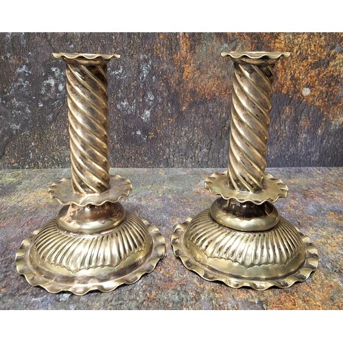 4 - A pair of late 19th century plated candlesticks, spirally fluted columns, low drip plates, domed bas... 