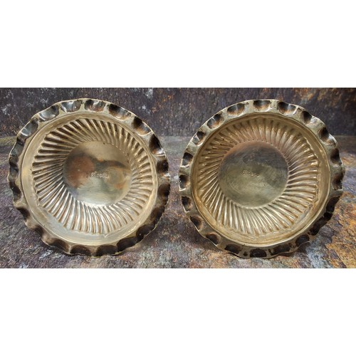 4 - A pair of late 19th century plated candlesticks, spirally fluted columns, low drip plates, domed bas... 