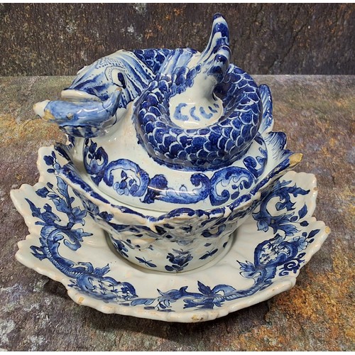 315 - A Dutch Delftware fish sauce tureen, cover and stand, Jan van der Kloot, painted in shades of cobalt... 