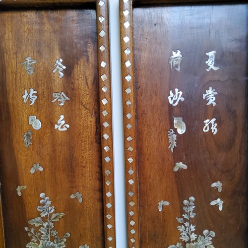 529 - Oriental Art - A pair of Chinese mother of pearl inlaid padouk wood panels, 83cm high, 16cm wide