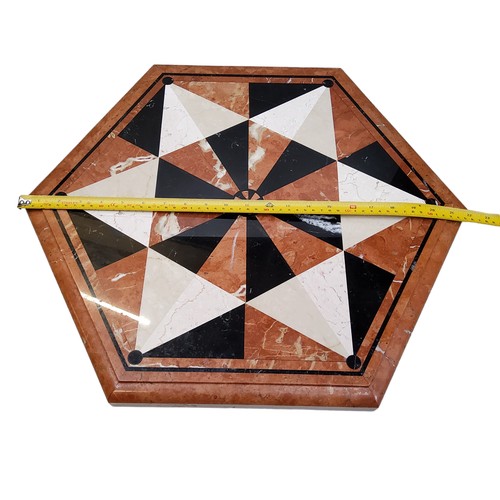 533 - A large hexagonal pietra dura table top, inset with belge noir, sienna and white marble specimens to... 