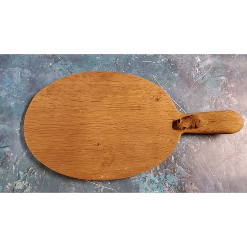 537 - Robert Thompson, Mouseman of Kilburn - an oak paddle shaped cheese board, 40cm long, carved mouse si... 