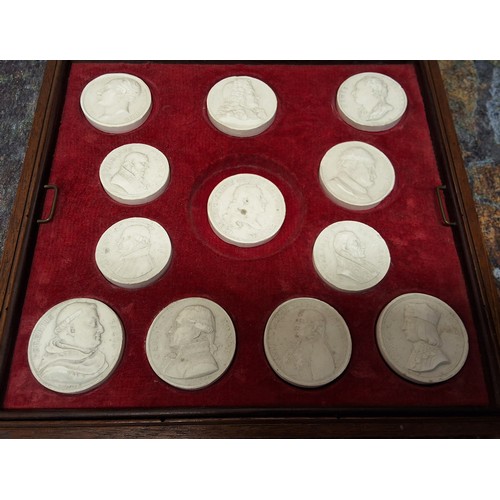 544 - Twenty-one circular plaster intaglios, of kings, noble men and painters, each approx 4cm diam, fitte... 