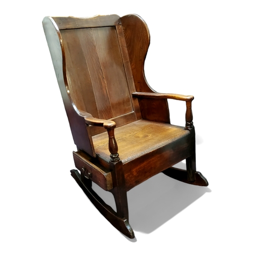 755 - An 18th century ash and elm rocking lambing chair with single drawer to frieze c.1760