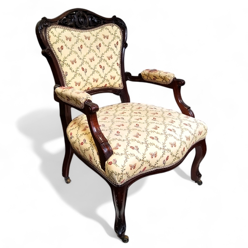 760 - A Louis XV walnut armchair, carved and pierced cresting rail above medallion back rest flanked by sc... 