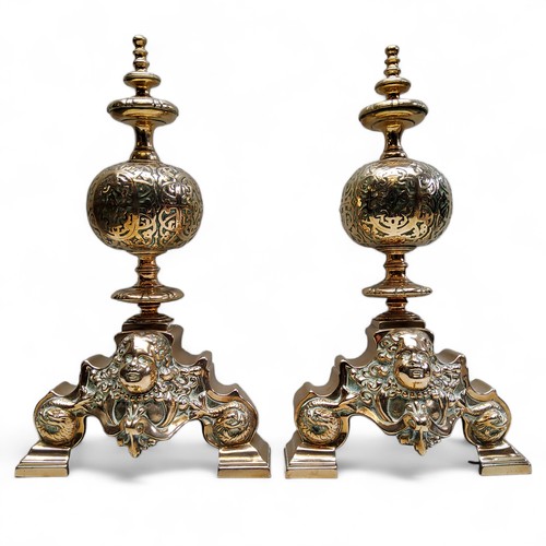 765 - A good pair of 17th century bronze Renaissance andirons, with lofty finials, above globular balls ca... 