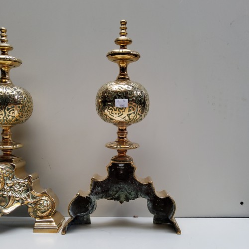 765 - A good pair of 17th century bronze Renaissance andirons, with lofty finials, above globular balls ca... 