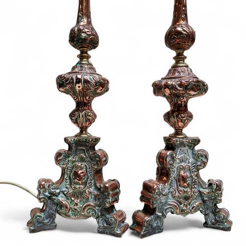 766 - A pair of 17th century style copper and brass  ecclesiastical pricket candlesticks, now as side ligh... 