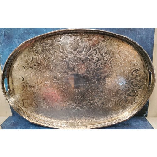 7 - A large E.P. on Copper oval gallery tray, the field die stamped with foliate scrolls, gadrooned rim,... 