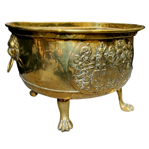 794 - A late 18th century Armorial brass log bucket, twin lion mask and loop handles (lacking one loop han... 