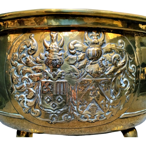 794 - A late 18th century Armorial brass log bucket, twin lion mask and loop handles (lacking one loop han... 