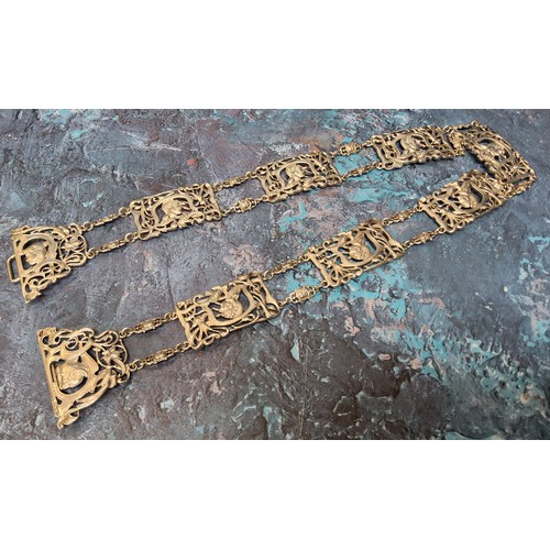 151 - An Art Nouveau silver nurses belt and buckle, each panel cast and pierced with a lady's side profile... 