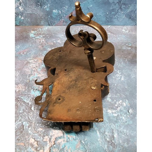 563 - A French iron door lock, in the 17th century style, triform crest, pierced with scrolls and mystical... 