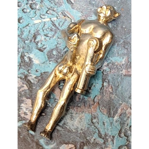 66 - An early 20th century solid silver risqué novelty lighter, in the form a devil or demon with articul... 