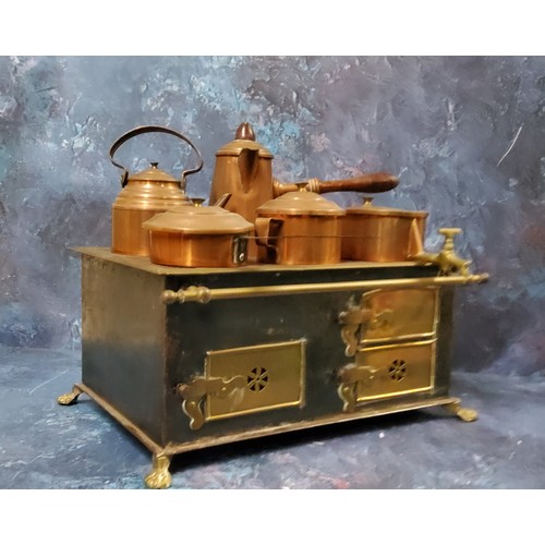 809 - A late 19th century child's cooking range, with copper kettle, coffee pot, saucepan, two handled pot... 