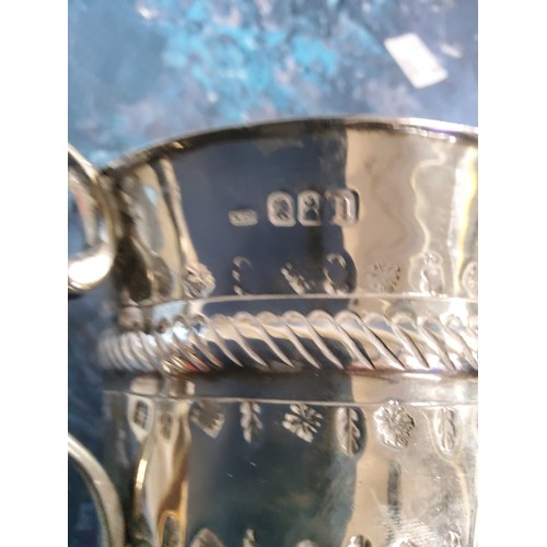 68 - A Queen Anne Britannia standard silver porringer, with fluted and punched vacant cartouche, embossed... 