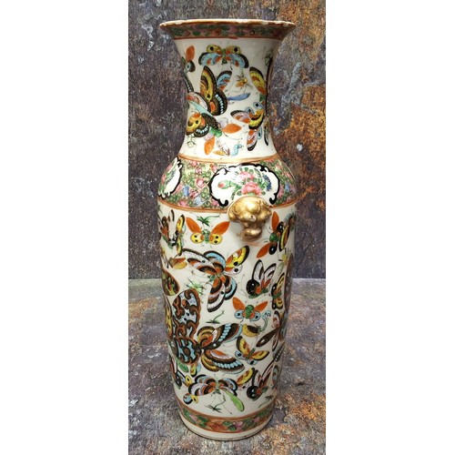 345 - A 19th century Chinese vase, decorated in polychrome with butterflies and insects, gilt mask handles... 