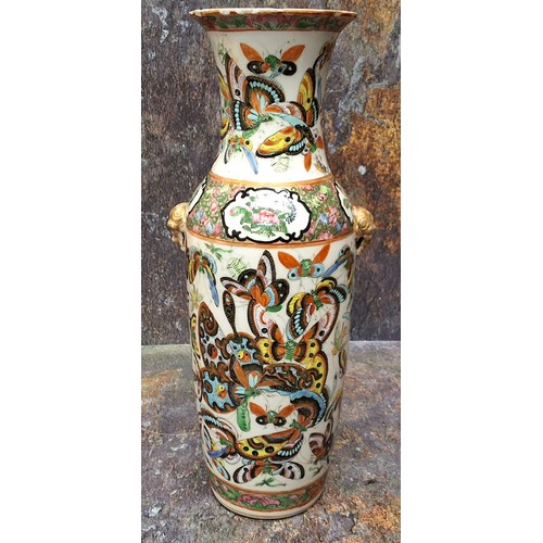 345 - A 19th century Chinese vase, decorated in polychrome with butterflies and insects, gilt mask handles... 