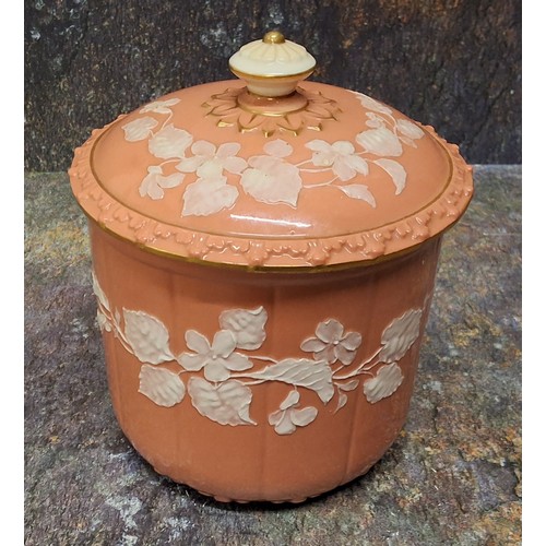 235 - A Grainger’s or Locke Worcester pate sur pate jar and cover, the salmon ground decorated with white ... 